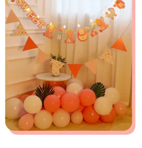 Cute elephant baby shower paper banner party decoration set with pink and white balloons.