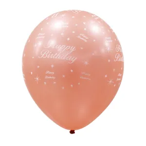 Primer plano de globo de fiesta de cumpleaños oro rosa con impresión blanca y estrellas.