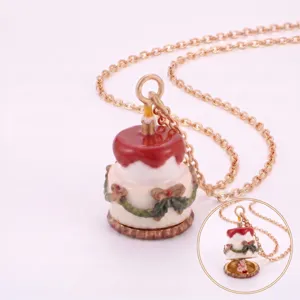 Collier pendentif gâteau chaîne dorée avec glaçage rouge, guirlande de Noël et design ouvrant.