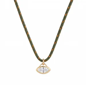 Minimalist stainless steel marquise zirconia pendant necklace with green woven cord detail.