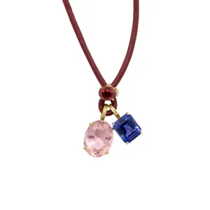 Detailed view of colorful gemstone leather cord necklace, vibrant multi-stone pendant.