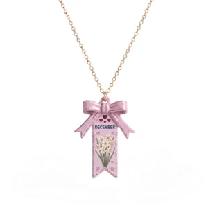 Collier de fleur de naissance de décembre avec joli pendentif nœud rose et chaîne.