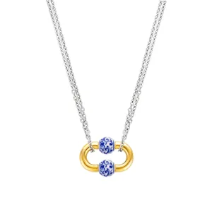 Collier en acier inoxydable avec perles en porcelaine bleue et design bicolore or.