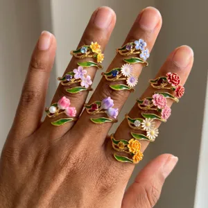 Colorful floral rings set featuring tulip and daisy designs, stylish enamel fashion jewelry.