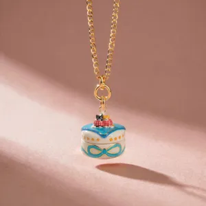Enamel cat pendant necklace detail, featuring a cute opening box design with gold chain.