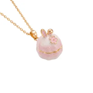 Close-up detail of the cute rabbit locket pendant necklace with enamel and gold-plated finish.