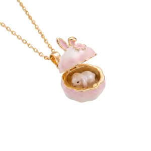 Exquisite gold-plated openable pink rabbit locket pendant necklace closeup detail shot.