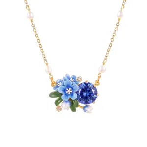 Elegant blue flower necklace with pearls and sparkling gemstone, exquisite gold chain jewelry.