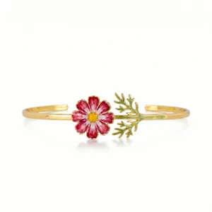 Detailed view of gold plated stainless steel enamel cosmos flower open cuff bracelet