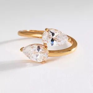 Detail shot of 18k gold plated stainless steel open ring with dual pear cubic zirconia stones.