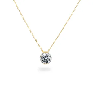 Detailed close-up of the elegant gold-plated bezel-set round cubic zirconia pendant.
