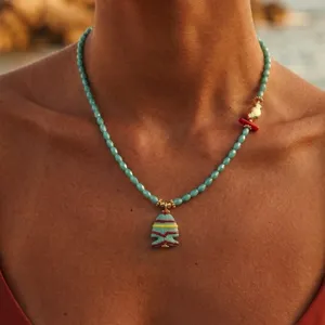 Detail view of the ocean fish beaded necklace, cute ceramic fish pendant with vibrant colors.
