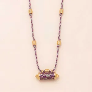 Detailed view of purple braided rope necklace featuring gold electroplated cylindrical pendant and beads.
