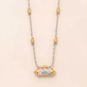 Fashionable pink braided rope necklace with golden beads and enameled cylindrical pendant.
