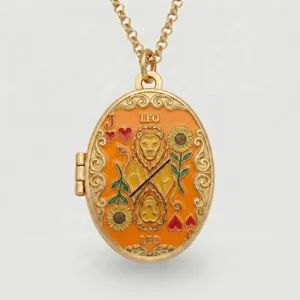 Gold plated oval locket necklace with orange enamel Leo zodiac and tarot playing card design.