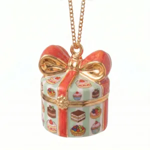 Exquisite gift box pendant necklace featuring cute cake and dessert patterns with gold bow detail.
