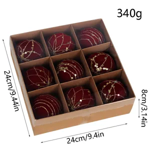 Set of 9 red velvet Christmas balls with gold glitter details in gift box, detailed view.