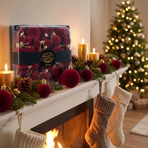 Detailed view of burgundy velvet Christmas ball ornaments, festive mantle decor setup.