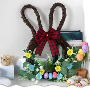 Close up of Easter bunny twig wreath with red plaid bow, daisies and colorful eggs detail.