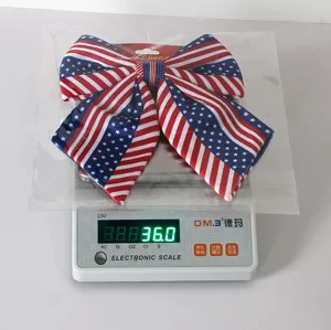 Detail shot of the American flag bow showing the star and stripe pattern on a digital scale.