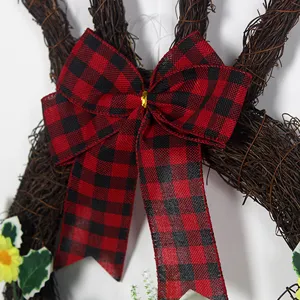 Easter bunny vine wreath featuring a classic red and black buffalo plaid bow and floral accents.