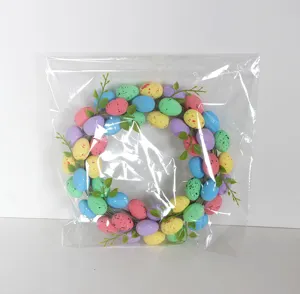 Easter egg wreath for front door home decor, colorful decorative wreath with eggs and leaves.