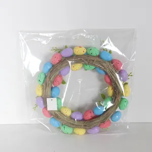 Easter egg wreath detail showing colorful speckled eggs and woven vine base for holiday decor.