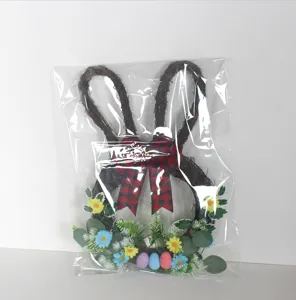 Easter bunny wreath detail showing twig ears, plaid bow, and colorful eggs for home decor.