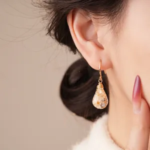 Bohemian resin dried flower teardrop earrings, elegant vintage wire-wrapped gold ear jewelry.