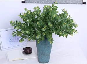 Artificial eucalyptus leaves detail view, realistic fake green plant for indoor home decor.