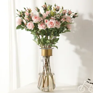 Vintage pink artificial rose bouquet, triple-head fake flowers for home and wedding decor.