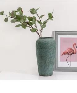 Faux eucalyptus leaves artificial plant branch for home indoor decor detailed closeup view