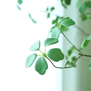 Artificial green lotus leaf branch for home decoration, fake plant foliage indoor decor.