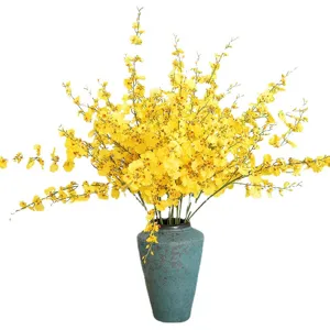 Artificial yellow dancing orchid silk flowers arrangement with ceramic vase for home decor.