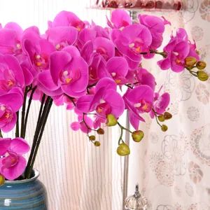 Fleurs d'orchidée artificielles dans un vase en céramique bleue fausse phalaenopsis décoration