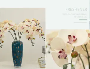 Artificial Phalaenopsis orchid silk flower arrangement in luxury blue ceramic vase decor.