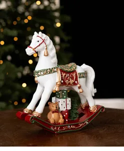 Detailed view of the Christmas resin rocking horse ornament with festive decor and cute bear.