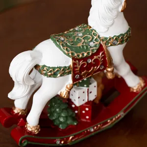 Christmas resin rocking horse tabletop decoration with gift box, festive holiday home decor gift.