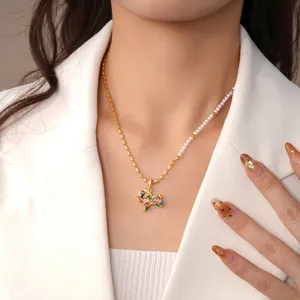 Chic half-pearl gold chain necklace featuring a stunning colorful crystal pony pendant.