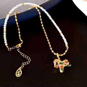 Exquisite colorful rhinestone horse pendant necklace with pearls and gold chain.