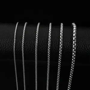 Stainless steel box chains necklaces set, multiple thickness silver tone metal jewelry display.