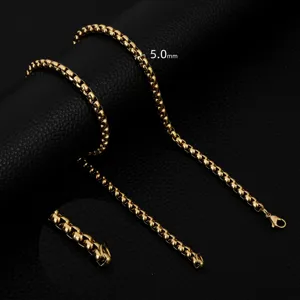 Close up detail of gold tone stainless steel box chain necklace, 5.0mm width fashion jewelry.