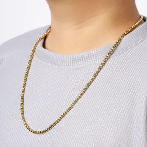 Gold stainless steel square bead chain necklace detail shot, fashion commuter jewelry design.