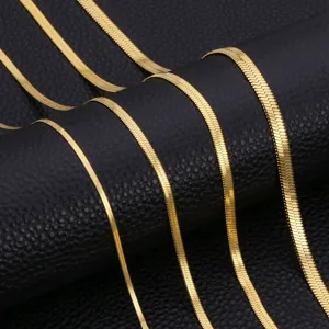 Close-up detail of exquisite 18K gold plated herringbone snake chain necklace for women.