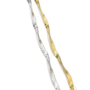 Exquisite dual-color blade chain necklace in silver and gold, elegant minimalist jewelry detail.