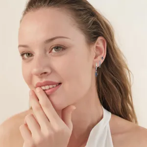 Square blue gemstone hoop and stud earring set featuring modern geometric metal design.