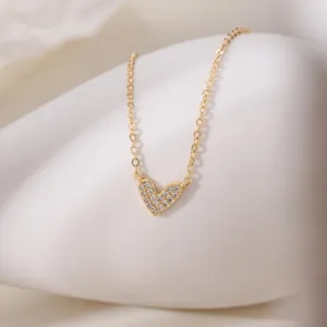 Close-up detail of the elegant gold-plated heart pendant necklace sparkling with cubic zirconia.