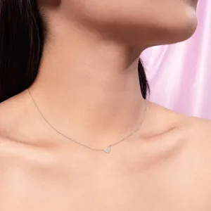 Delicate silver tone pave cubic zirconia heart pendant necklace, elegant clavicle chain detail view.