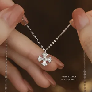 Silver cross necklace for women, dainty sterling silver clavicle chain with shimmering pavé stones.