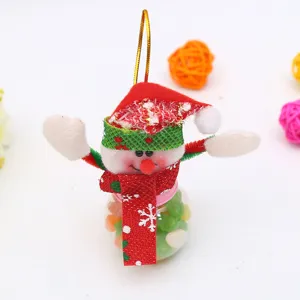Close-up of cute Christmas snowman ornament with candy jar and colorful candies inside.